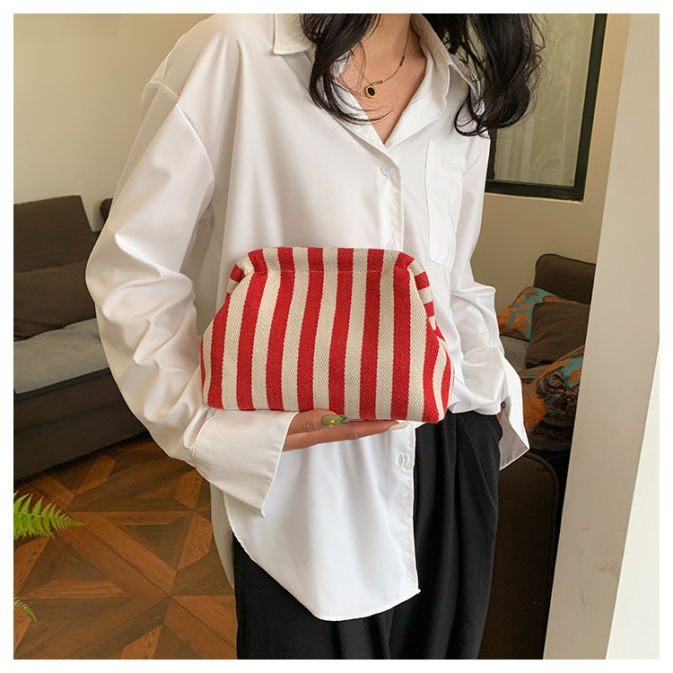 New cross-border fashion color-blocking striped cosmetic bag, women's loose change mobile phone storage bag, trendy and niche cloud clutch undefined