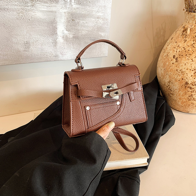 Nicho de diseño Kelley bolso 2024 otoño nuevo bolso de mano lichi mochila texturas extranjeras mochila para mujeres