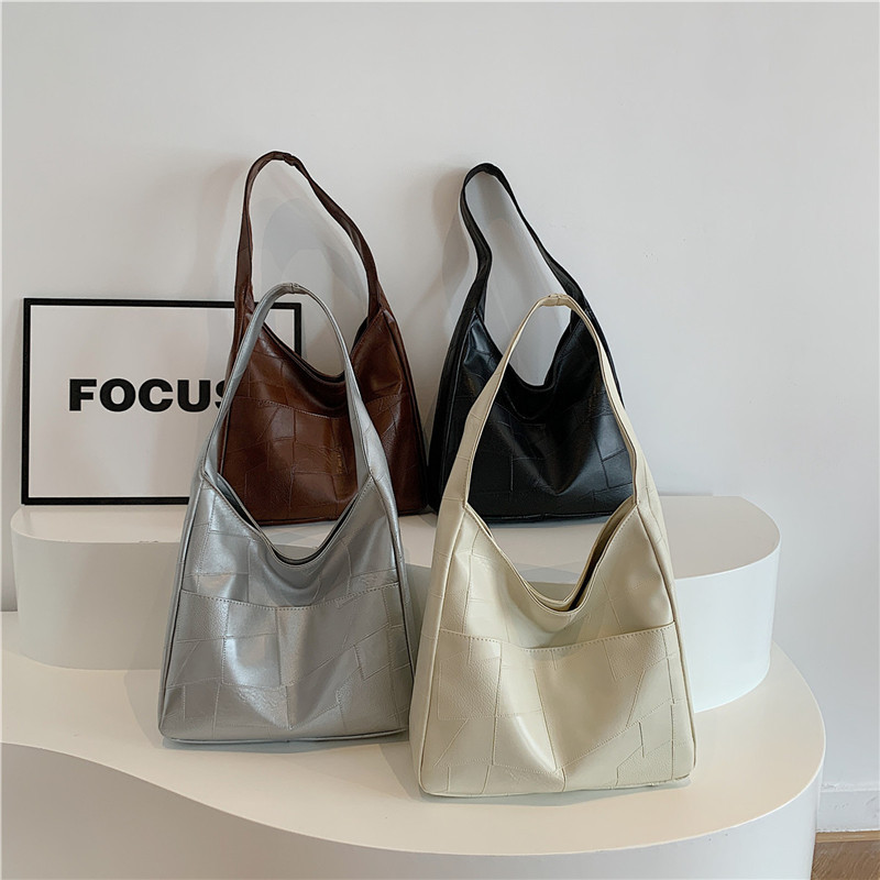 Bolso de color sólido para mujeres 2024 primavera y verano nueva bolsa de gran capacidad bolsa de moda extranjera bolsa de hombro mochila bolsa de viaje