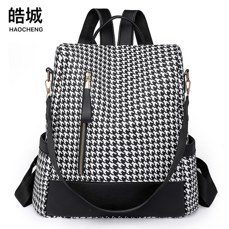 Comercio exterior al por mayor 2023 nueva versión coreana de las señoras de cuero suave mochila antirrobo moda contraste color bolsa de viaje al aire libre de doble uso