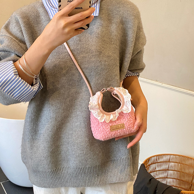 Bolsos para niños nuevos bolsos de encaje de color sólido extranjero nicho de diseño para padres e hijos cambio bolsos de mochila