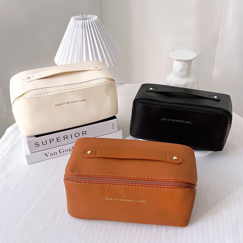 2025 nueva bolsa de cosméticos de celebridades de Internet ins bolsa de almohada de órgano bolsa de almacenamiento de Pu de gran capacidad caja de cosméticos lavado de viaje