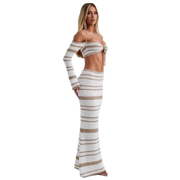 Conjunto de verano para mujer, estilo europeo-americano, con top halter de manga larga a rayas y falda, ideal para cruzar fronteras (2026)._voghion.com