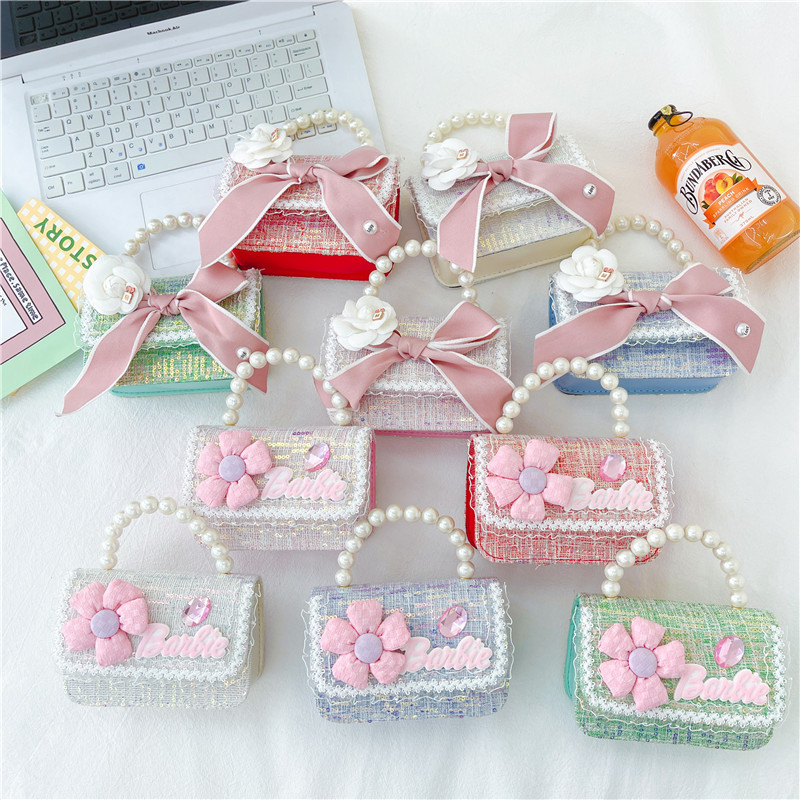 Bolso de los nuevos niños al por mayor bolso de princesa Linda pequeña flor arco accesorios bolsa versátil bolsa de mensajero de las muchachas
