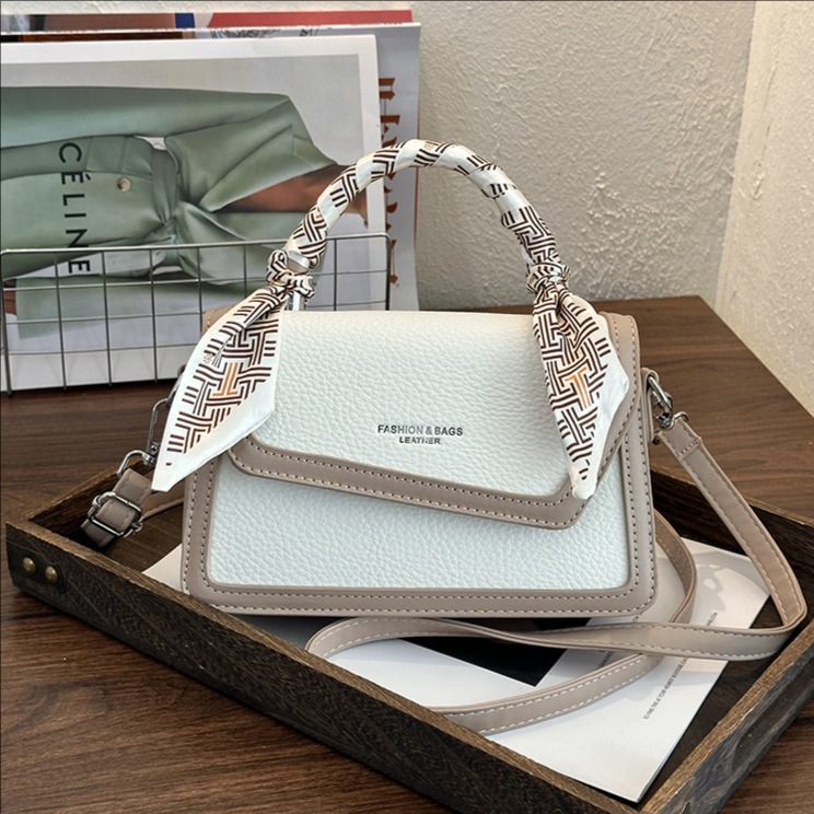 Bolso retrógrado portátil para mujeres 2026 nuevo estilo coreano empalme color contraste de moda extranjera multifuncional mochila de hombro