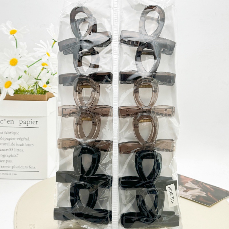Pinza para el cabello de material PC irrompible color té con leche, pinza grande transparente color café para la parte posterior de la cabeza, accesorio para el cabello de supermercado a dos yuanes.