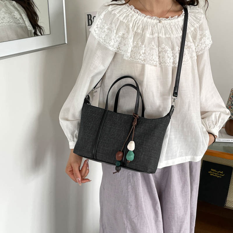 Bolsa de mano de gran capacidad de viaje coreano para mujeres 2026 nueva moda de verano simple bolsa de hombro retro