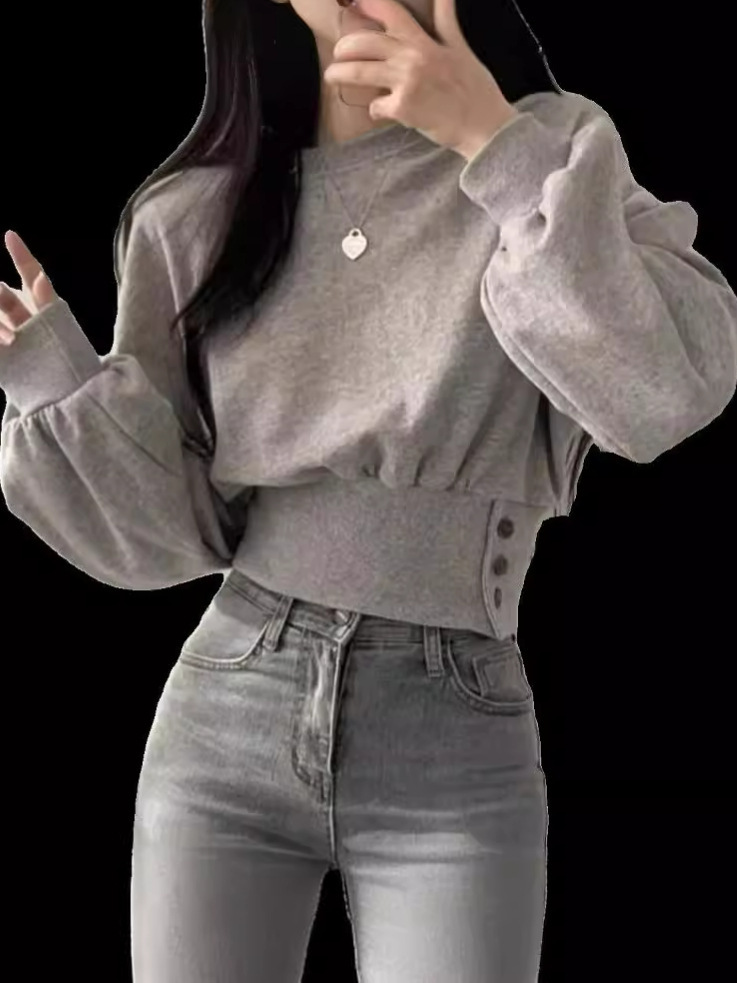 韓国のchi秋のデザイン感丸首はウエストを締めて痩せている長袖の短いプルオーバーの上着の女性です。