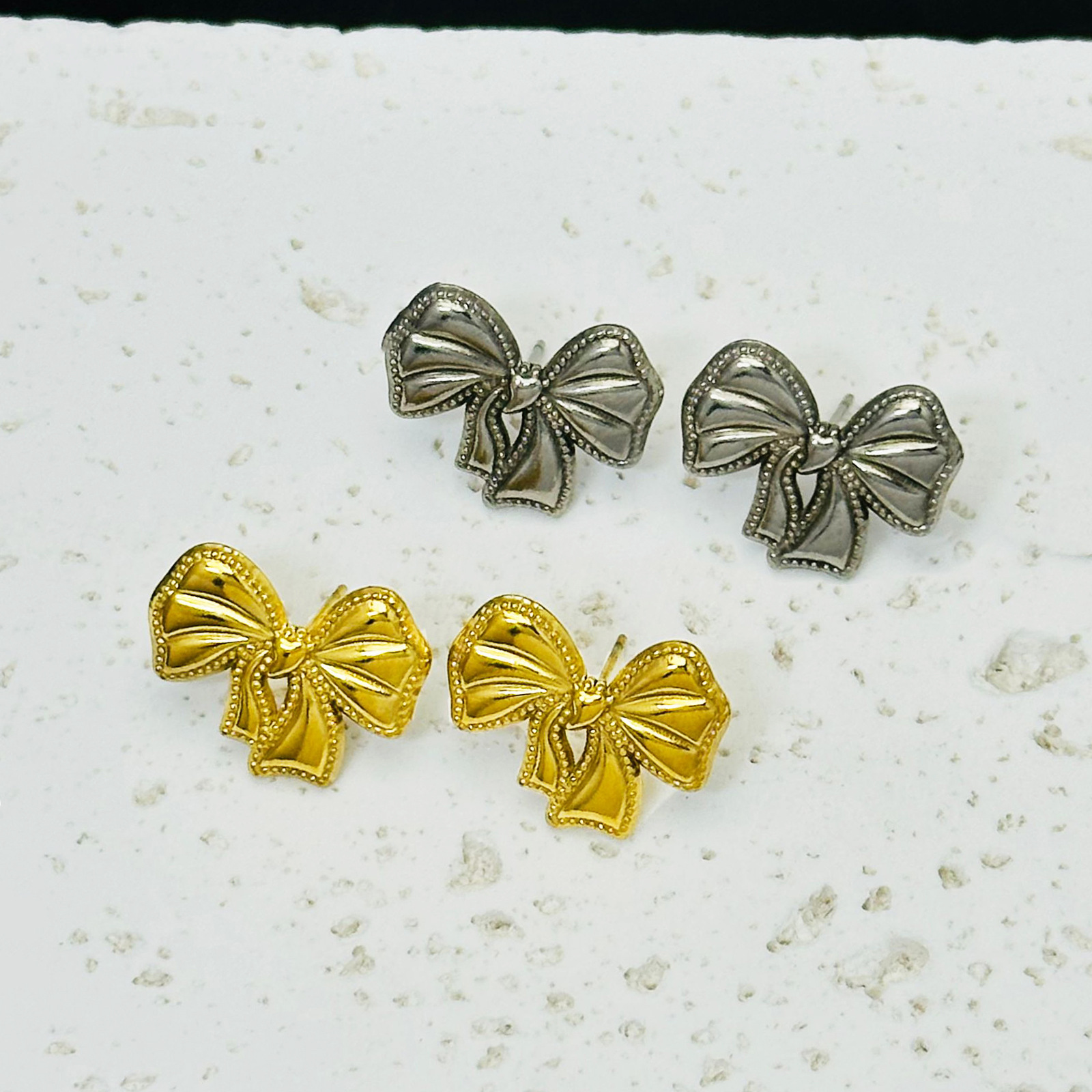 Bow set pendientes ligero lujoso estilo transfronterizo colgante de acero de titanio no decolor 18K joyas de oro ins