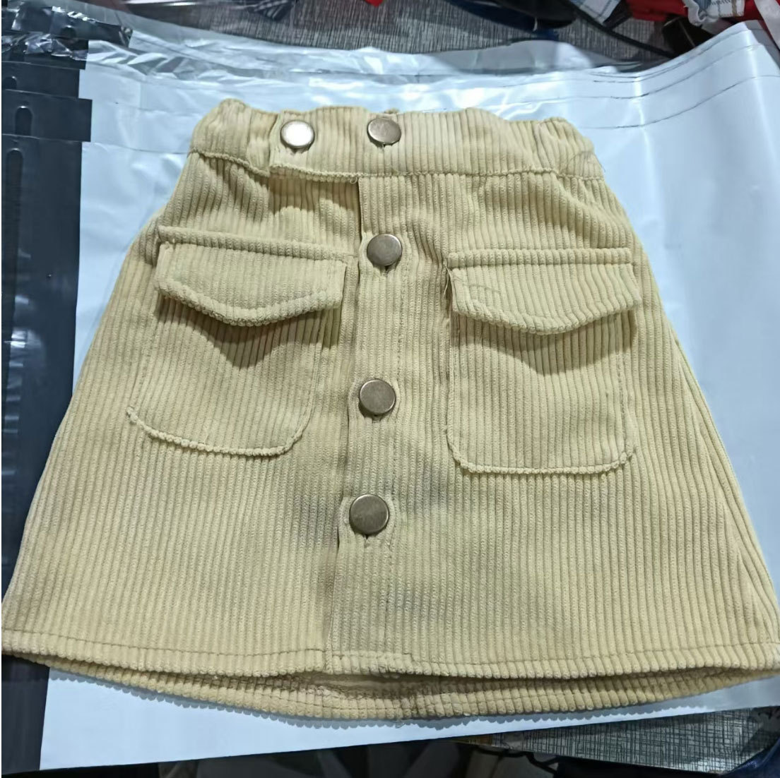 Primavera y otoño de las niñas falda de corto nuevo estilo extranjero de niñas meandruño una falda corta coreana para niños con una falda corta en forma de A