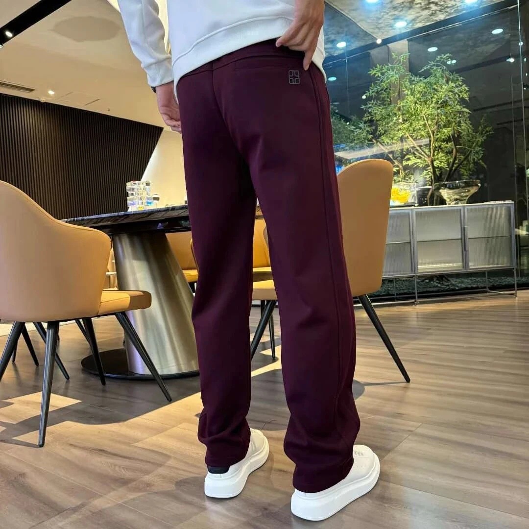 Primavera y otoño pantalones juveniles para hombres 2025 nuevos pantalones casuales rectos sueltos otoño y invierno con pantalones deportivos de lana