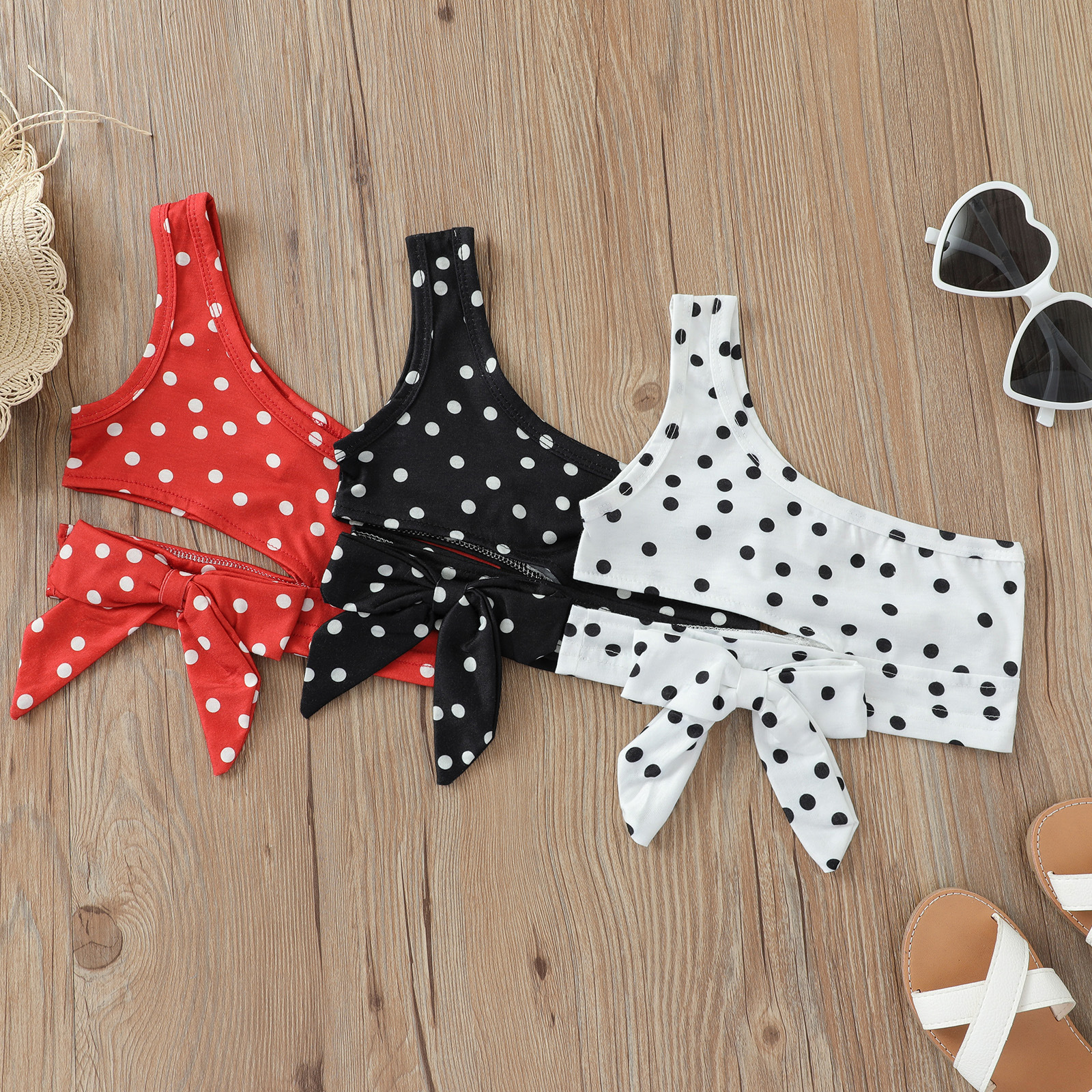 Chaleco transfronterizo para niños verano nuevas niñas Honda Polka Dot ombligo corto Top arco hombro camisa corta europea y americana