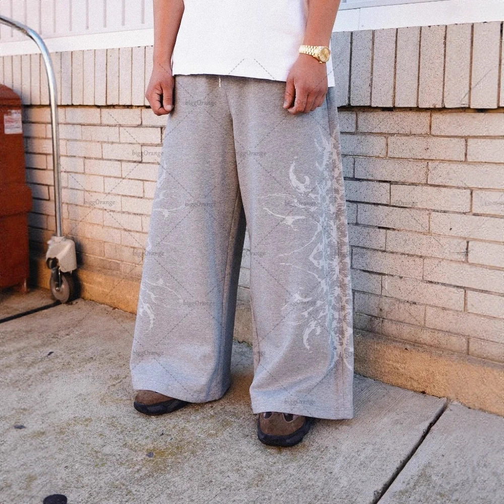 Europa y Estados Unidos transfronterizos estadounidenses tendencia hip-hop personalidad callejera pull-out pantalones casuales de moda impresa pantalones rectos sueltos