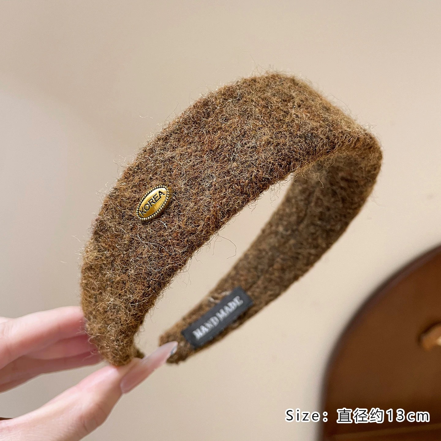 #215 brown woolen oval gold label headband