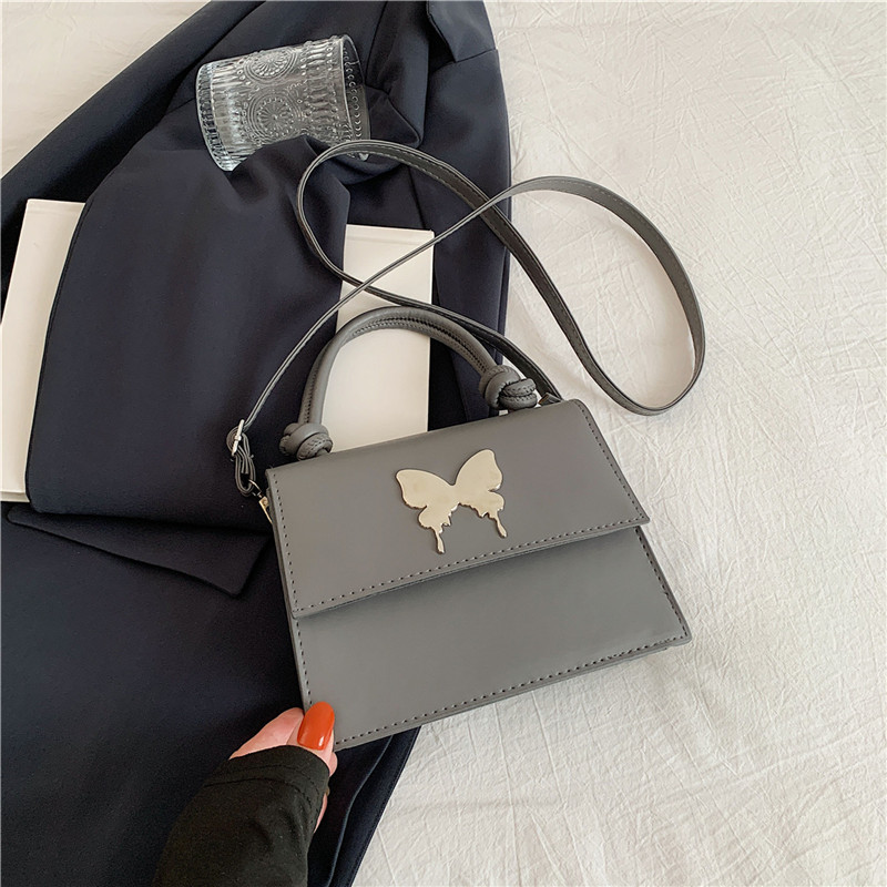 Diseño de nicho de lujo ligero bolso de mano de este año popular arco decoración de viaje diario mochila de hombro para mujeres