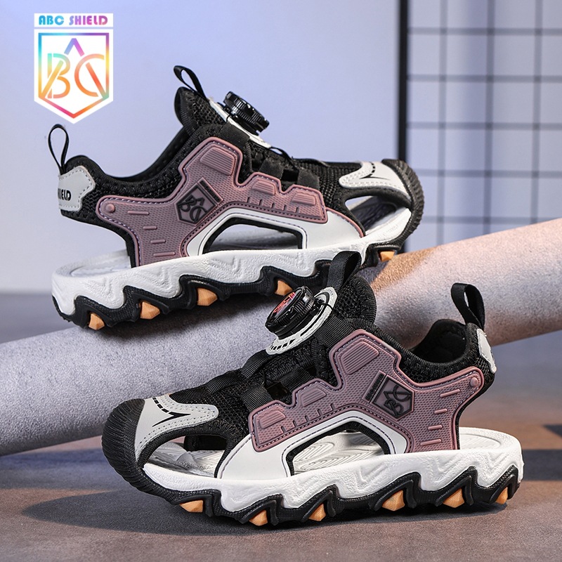 Sandalias para niñas Verano 2025 Sandalias antideslizantes de malla para niños Zapatos de playa Baotou Botón giratorio Sandalias para niños