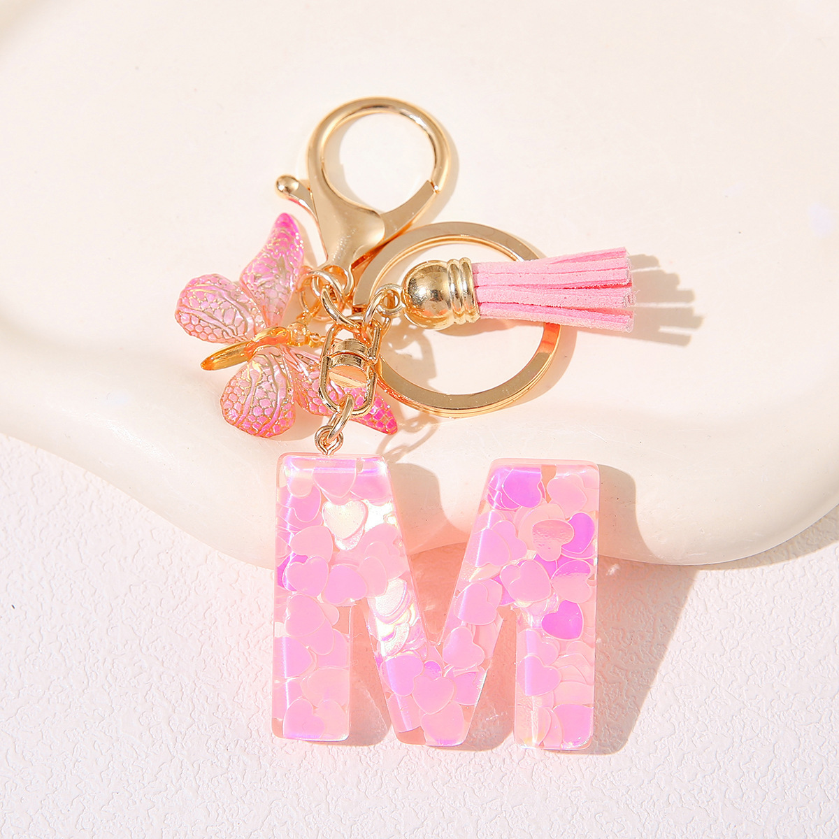 Nuevo rosa damas letras A-Z llavero de goteo de goma sequilla amor letras bordas mariposa llavero transfronterizo