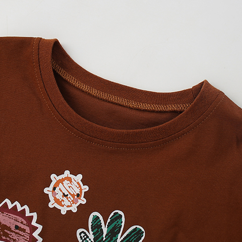 Camiseta para niños de manga larga nueva 2023 tops de ropa para niños europeos y americanos con estampado de dibujos animados de dinosaurios y camisa de fondo de algodón puro