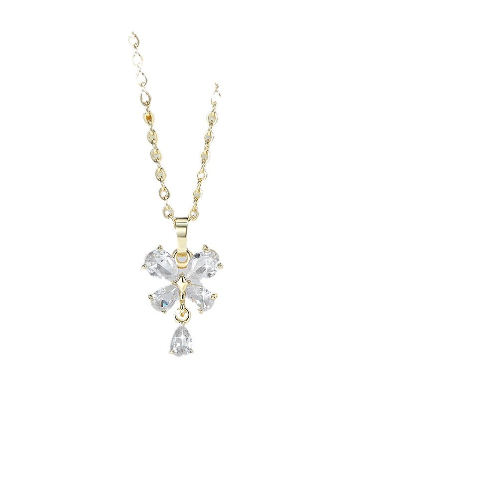 Exquisito conjunto de adornos de flores de cuatro hojas de diseño de moda transfronterizo cobre chapado en oro 14K colgante de flores de zircon aretes