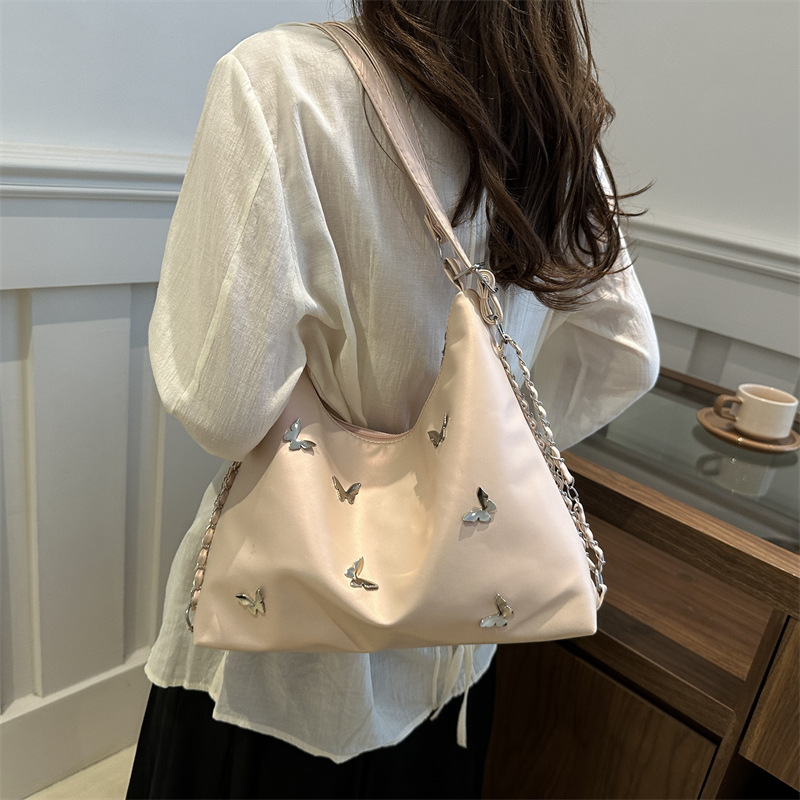 Bolso de cadena de moda popular para mujeres 2024 verano nuevo bolso de hombro de gran capacidad nicho mariposa mochila de trabajo