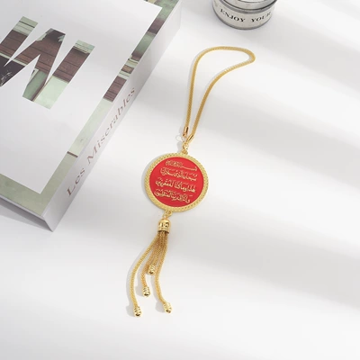 Black and gold round plaque with Car hanging - red