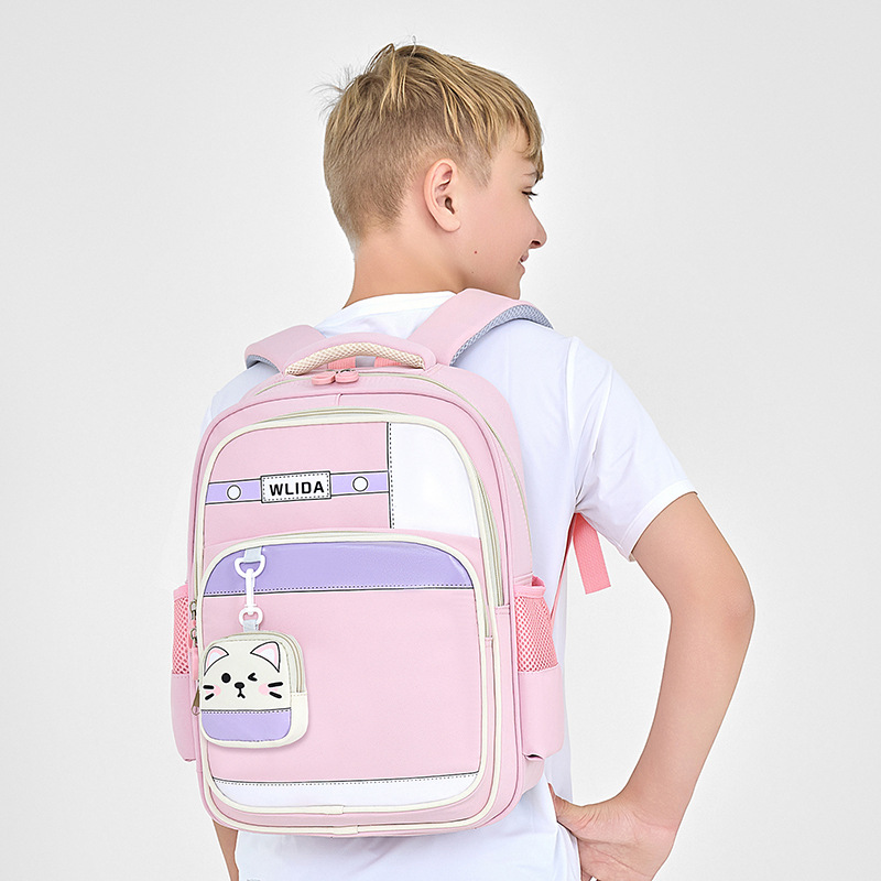 Mochila mayorista para estudiantes de primaria nueva mochila para niños y niñas de grado 1 - 3, mochila ligera para reducir la carga, mochila de ocio resistente al desgaste