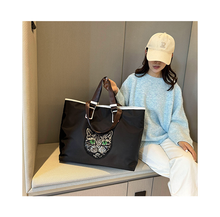 New Portable Travel Shopping Bag For Outgoing Large Capacity Storage Handbag One Shoulder Shining Cat Head Tote Women's Bag_voghion.com