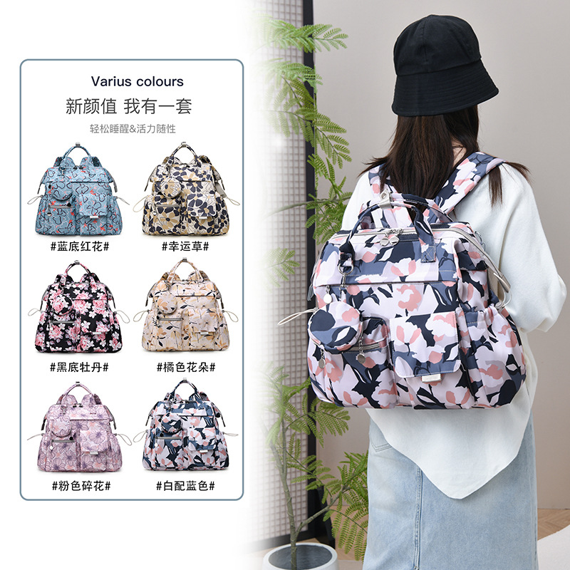 Cross-border wholesale printed double-shoulder diaper bags, large capacity diaper bags, new style breastfeeding diaper backpacks.