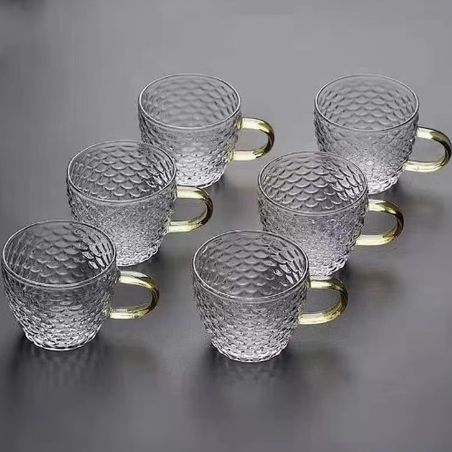 Venta directa de fábrica Tetera de vidrio con alto contenido de borosilicato Tetera de espuma con patrón de martillo de viga de elevación de metal Tetera de vidrio de alta calidad para el hogar