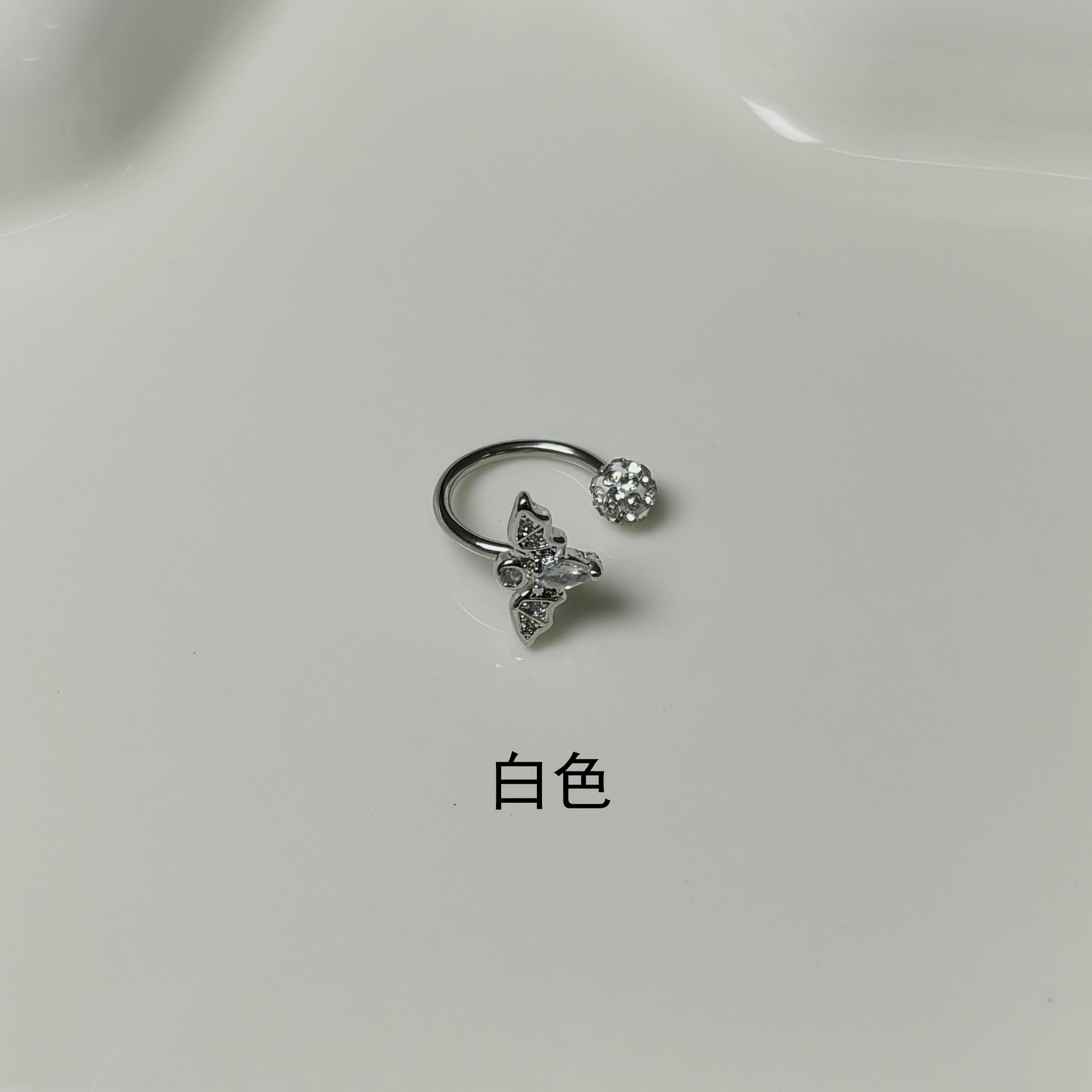 Silver pointed spike labret stud material detail
