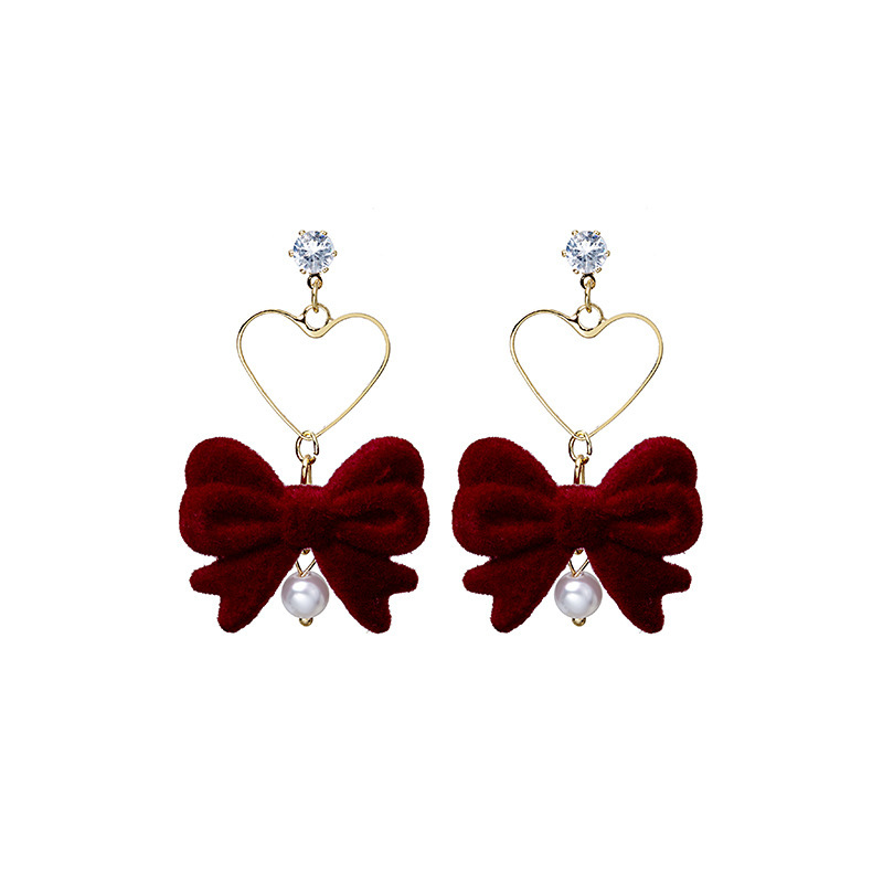 Aguja de plata Otoño e Invierno rojo vintage flocado arco borla pendientes ins Año Nuevo vino rojo Bola de piel pendientes de perlas