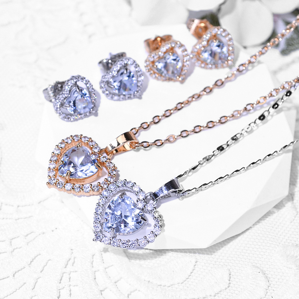 2024 selección transfronteriza moda amor aretes de zircon collar conjunto de joyería para mujeres aretes de zircon colgante joyería