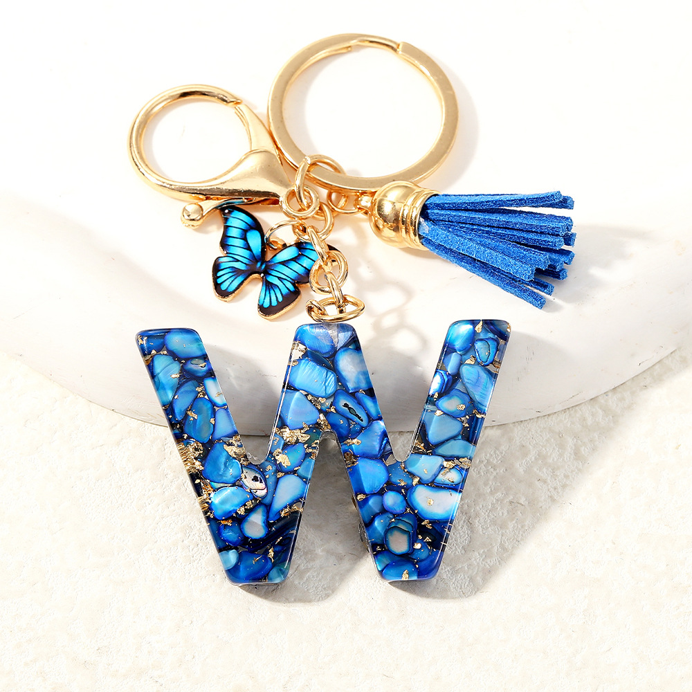 Nuevo transfronterizo mariposa 26 letras inglesas de cristal goteo llavero bolsos accesorios colgante de automóviles