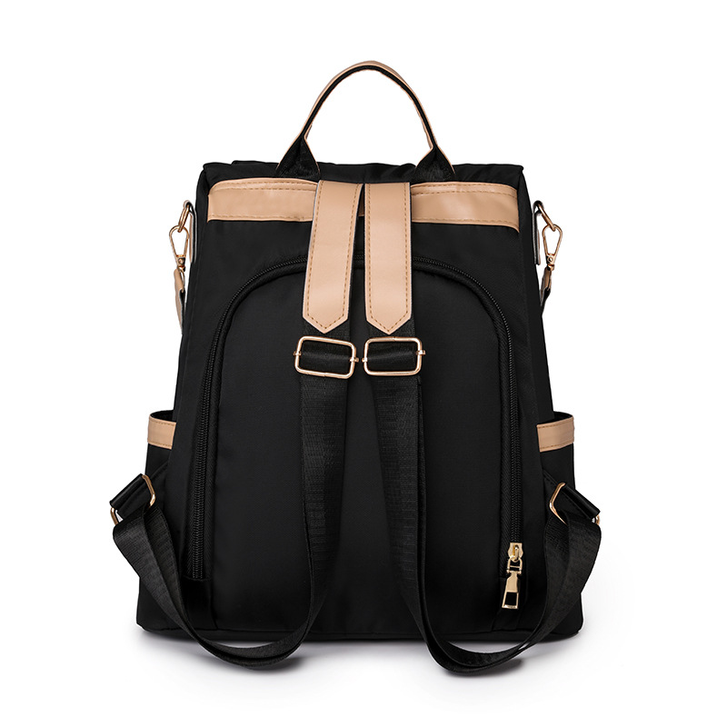 Mochila de nailon ligera casual de moda para mujer nuevo estilo de viaje anti-salpicaduras de agua, resistente al desgaste, antirrobo, mochila de viaje coreana de moda