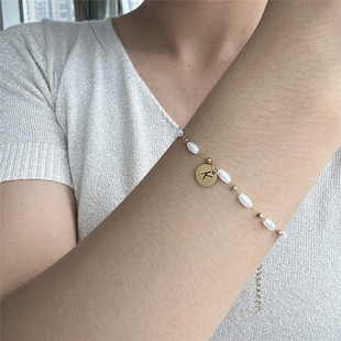 Japanese and Korean small and exquisite stainless steel oval pearl chain coin letter pendant couple niche bracelet