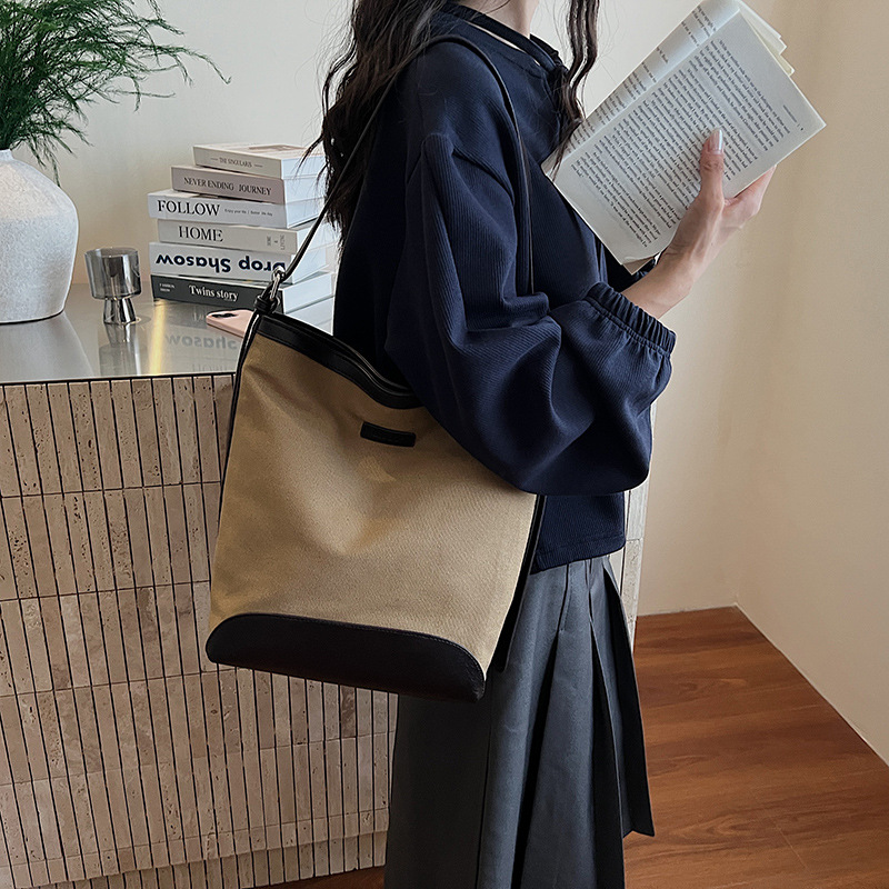 Transfronterizos de gran capacidad bolso de balde de mujer bolso versátil otoño / invierno 2025 nuevo tipo de mochila de hombro casual bolso de transporte