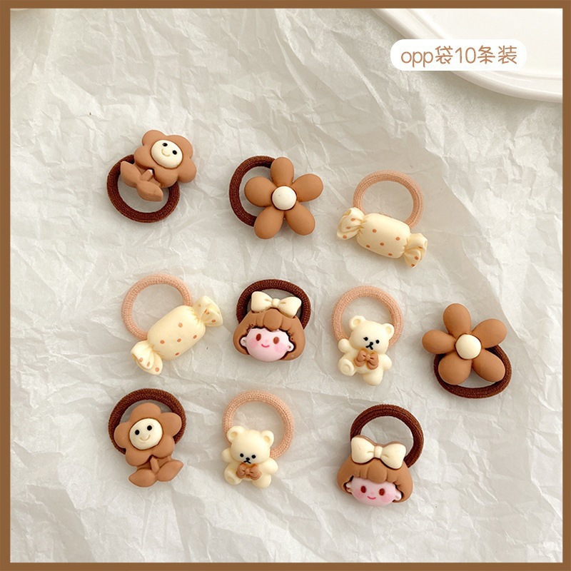 La banda de goma marrón leche simple y Linda para las mujeres no duele la banda del pelo de la cuerda del pelo de la cola de caballo del tamaño pequeño para las mujeres