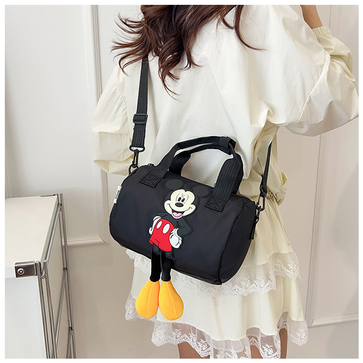 The 2021 new children's bags feature a cute Mickey Mouse pattern bowling bag for girls and a fashionable hand-held shoulder bag undefined