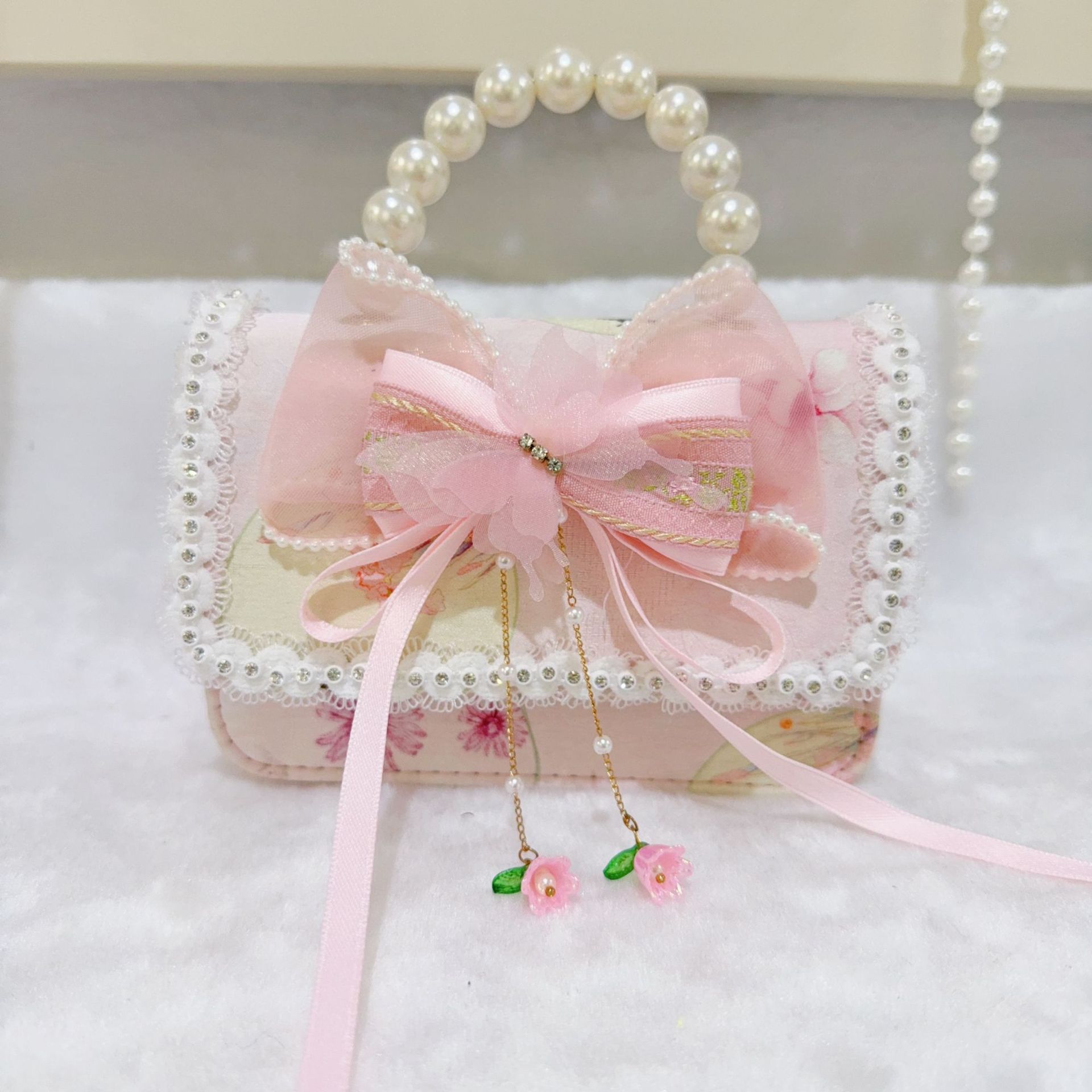 Otoño nuevo bolso infantil princesa perla bolso de mano pequeña fragancia chica bolso de moda bebé portátil