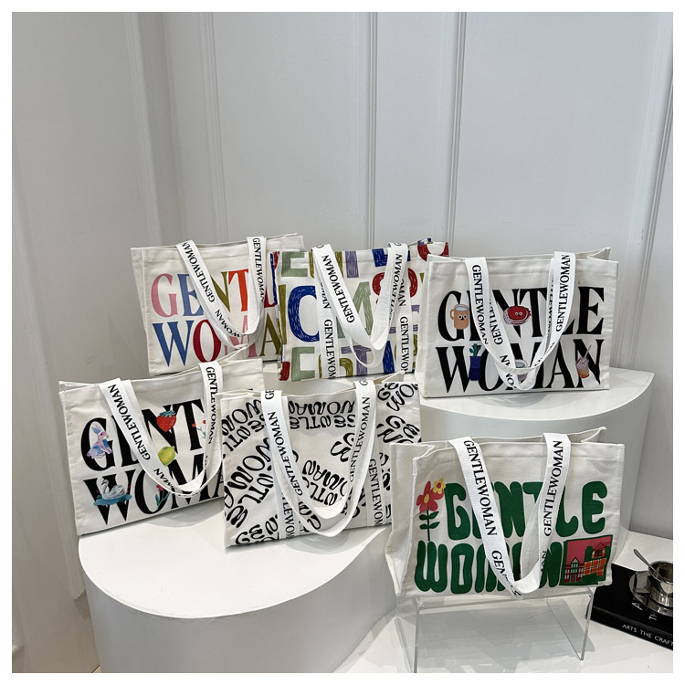 Large-capacity letter canvas bag 2025 new style ins printed versatile shoulder bag for commuting and portable ladies' tote bag undefined
