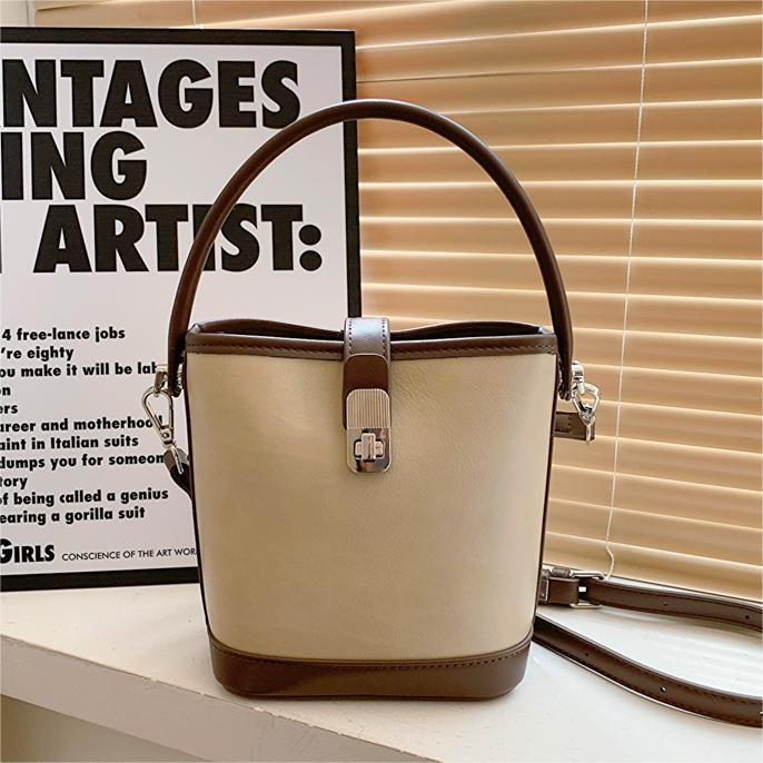 Bolsa de mano coreana de nicho universal, dama 2024 nuevo bolso de hombro, bolso de cubo de moda de alta calidad