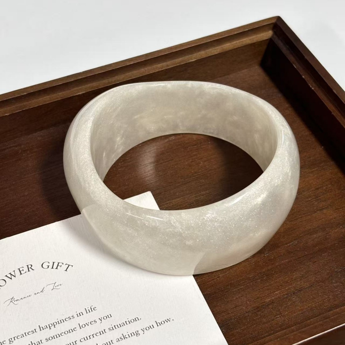 Fine shimmering moonlight white (inner diameter 66.8 weight 67.2 grams)