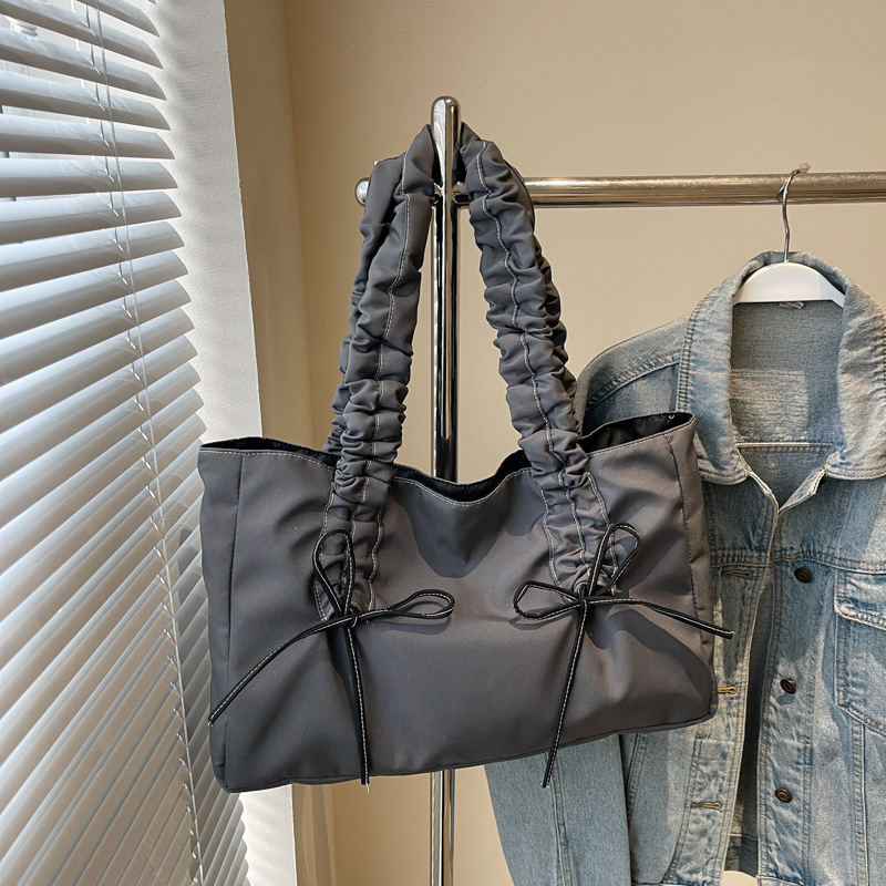 Bolso de arco de la mujer 2025 nueva moda coreana bolso de tela de gran capacidad bolso de mujer de alto valor facial
