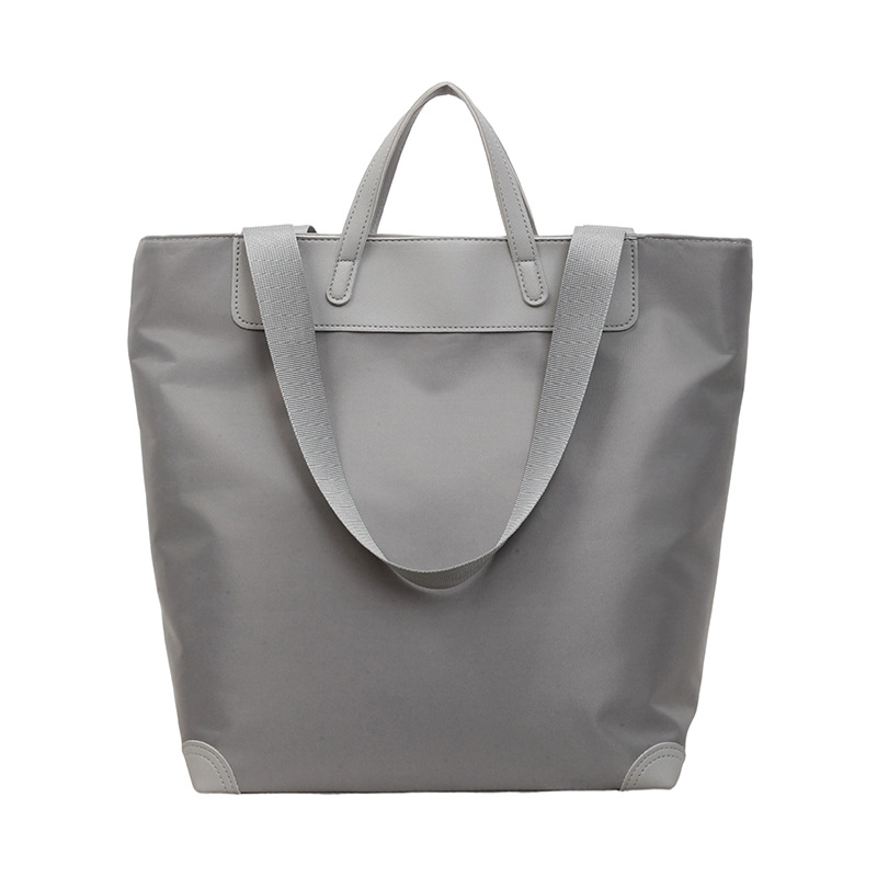 Nuevo estilo coreano de alto valor, bolso de mano casual simple, bolso de hombro de gran capacidad de viaje ligero de tela de nylon.