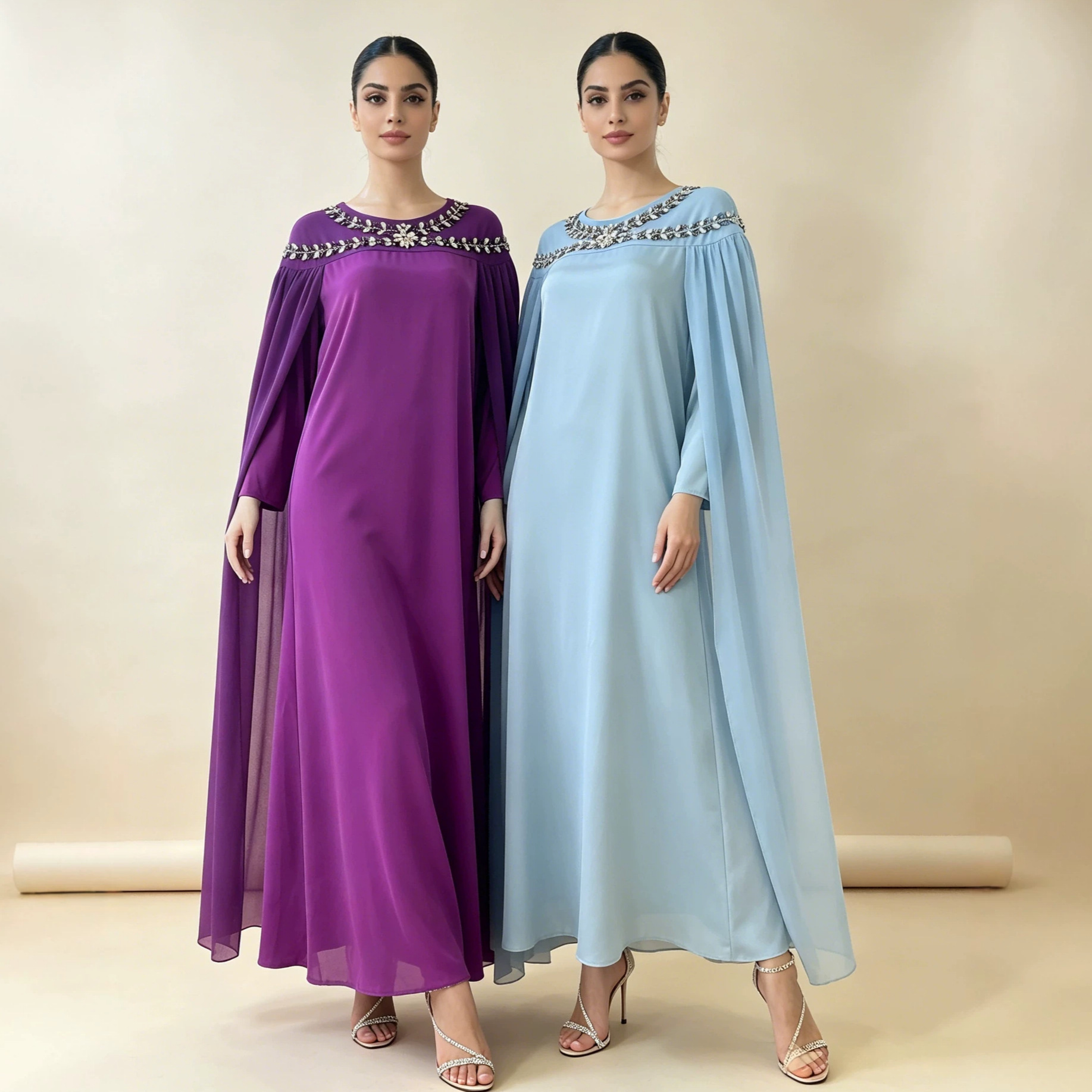 In stock: Elegant long robe with heavy rhinestone shoulder embellishments, chiffon cape sleeves, satin drape, loose fit, and figure-flattering design.