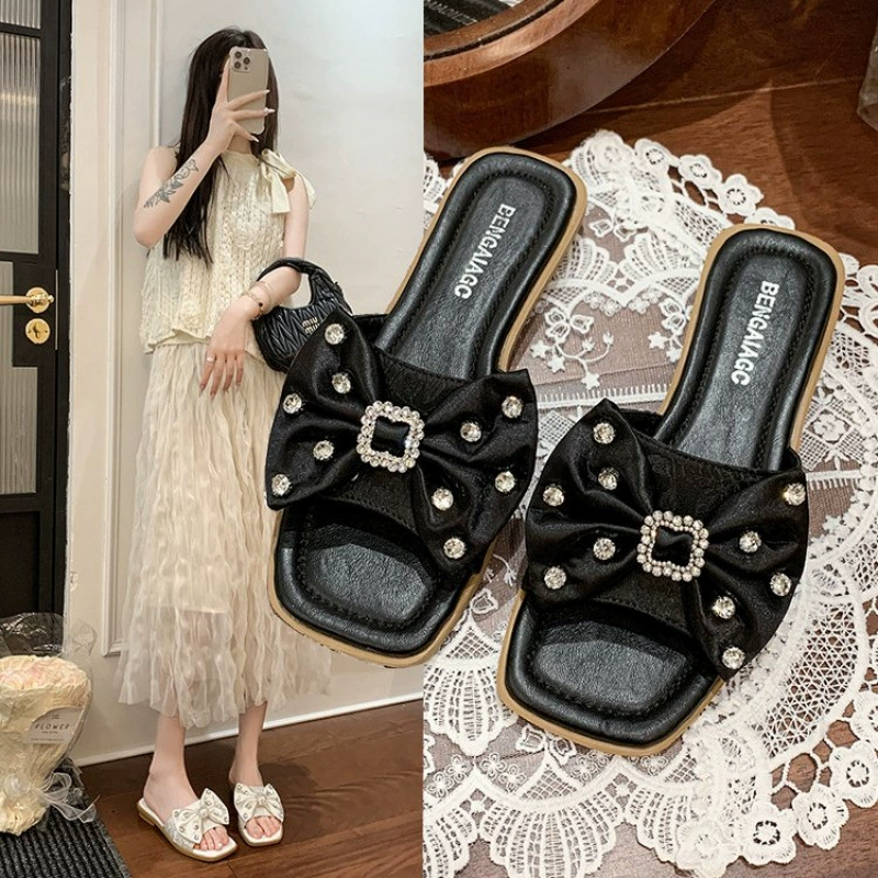 Французские тапочки для женской верхней одежды 2025 новые высококачественные босоножки с бантом модные универсальные плоские пляжные туфли