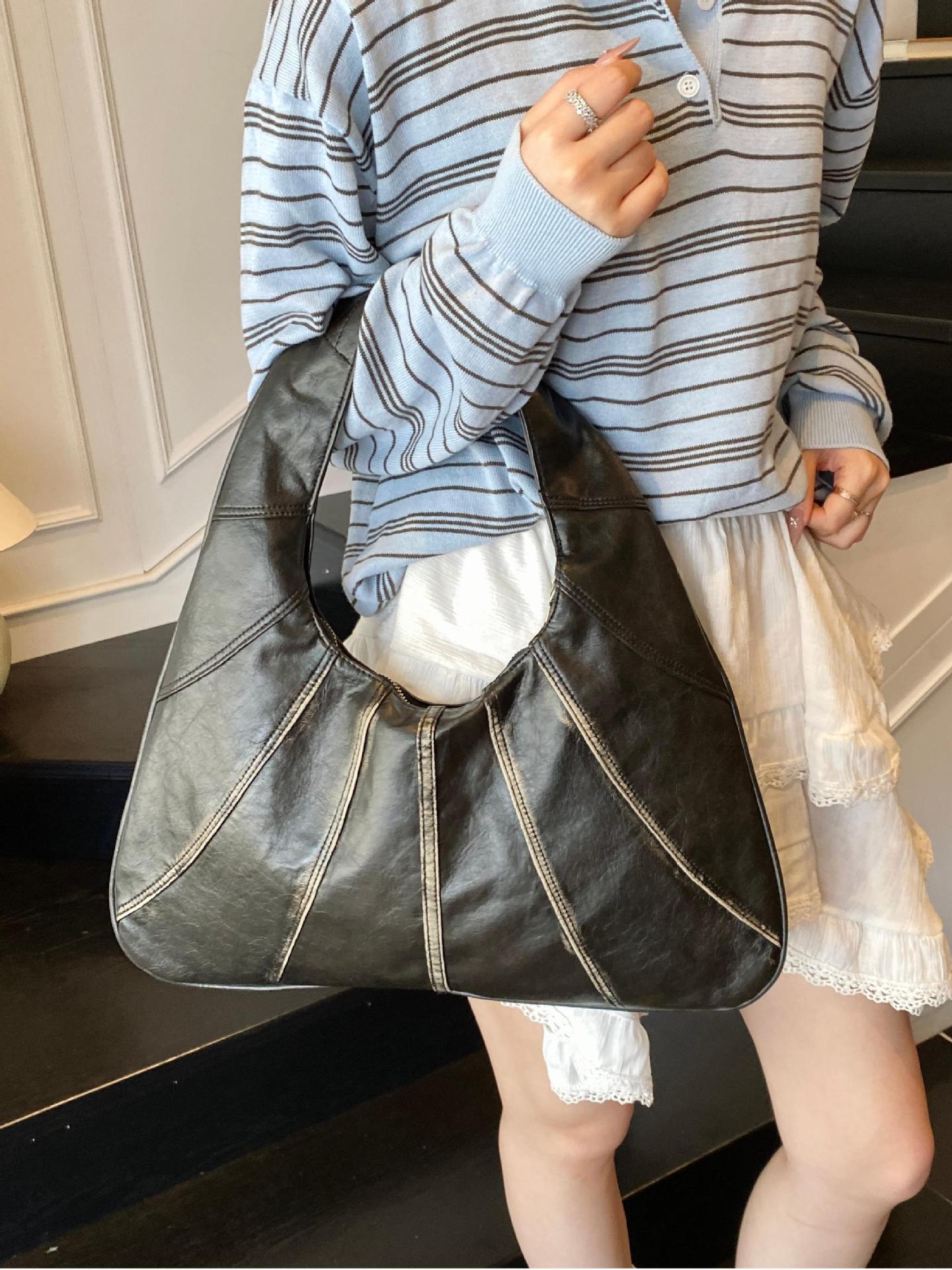 Bolsos retro para axilas para mujer 2025 nuevo bolso de hombro de nicho casual de todo fósforo bolso de viaje portátil de alta gama de moda
