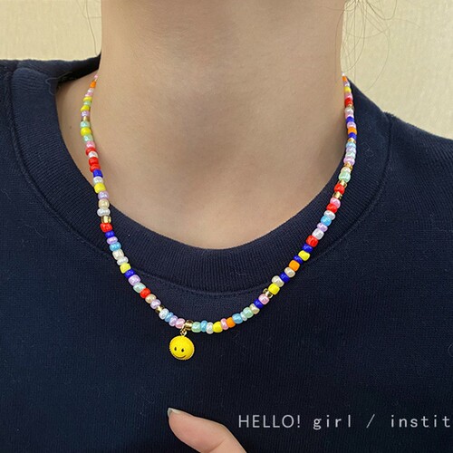 New year's new color beaded smiley sweatshirt necklace women's high-end design niche hot girl clavicle chain accessories
