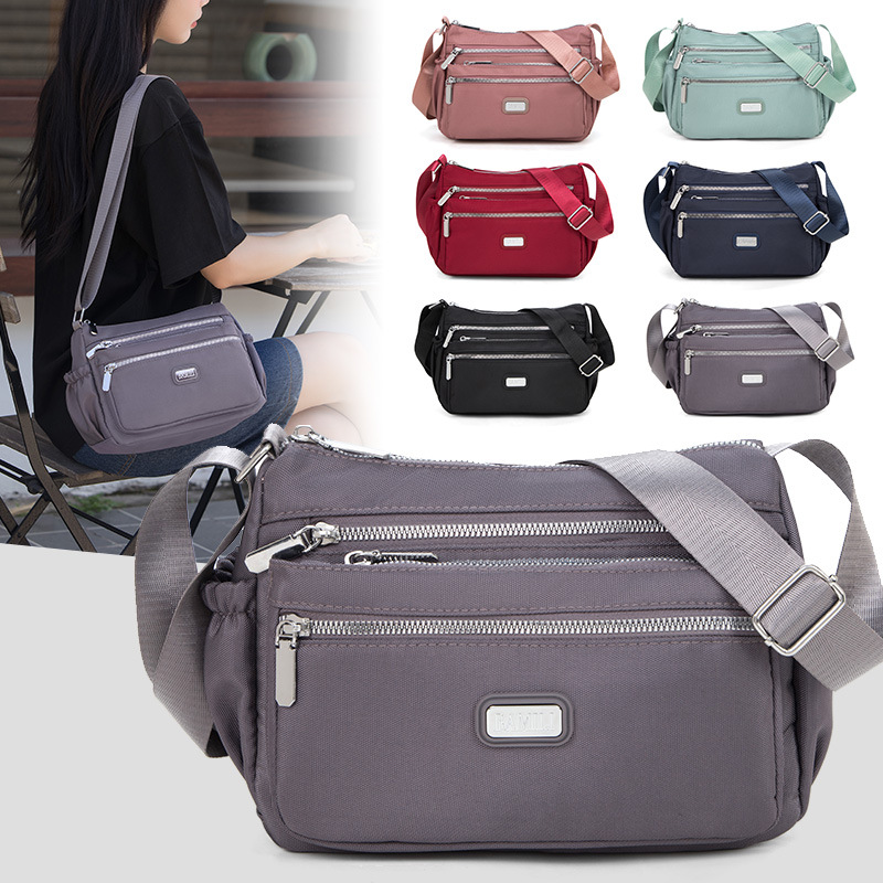 Bolso bandolera de tela Oxford para mujer 20247 nuevo bolso de mujer de mediana edad, bolso de madre de nylon de viaje de gran capacidad, todo fósforo