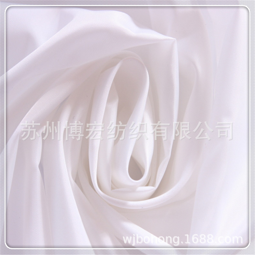 厂家现货供应210T涤塔夫练白里料羽绒服胆布双面压光防绒面料